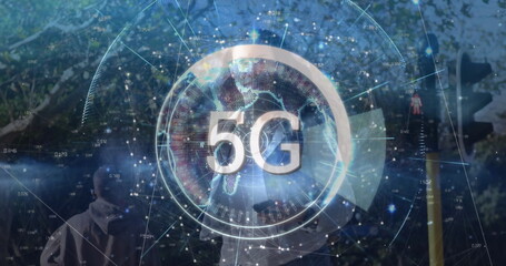 Projecting holographic 5G overlay over surveyor wearing hard hat and holding GNSS pole in woodland