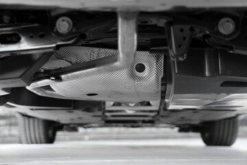 glues soundproofing material to outside of car bottom. Process of car sound insulation...