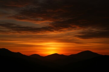 Fototapeta premium Fiery Sunrise Over Majestic Mountains