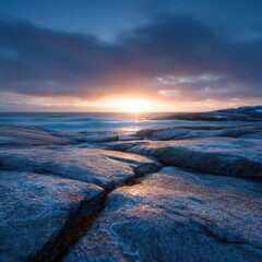 Sun glistens on ocean and rocks during sunrise. Scenic landscape, coastal nature, seascape photography, travel destination