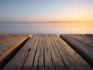 Old wooden pier leading towards the peaceful water at sunset. Rustic dock, seaside, relaxation, tranquil scene, outdoor, scenic view