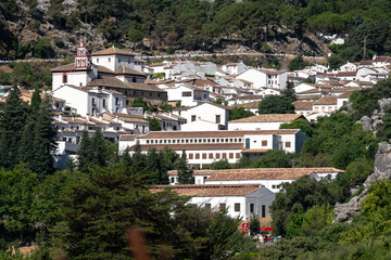 Panoramic view of the beautiful white village of Grazalema in a sunny day. Cadiz, Andalucia, Spain.