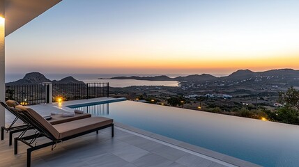 Obraz premium Panoramic sunset view from a luxury infinity pool.