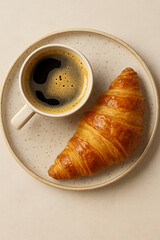 French Breakfast with Croissant and Coffee on Ceramic Plate