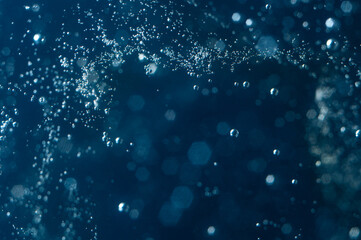 Bubbles rising through deep blue water during a calm underwater exploration session