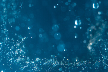 Bubbles rising through deep blue water during a calm underwater exploration session