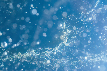 Bubbles rising through deep blue water during a calm underwater exploration session