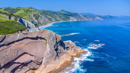 Flysch cliffs rising from the turquoise sea of zumaia, basque country, spain