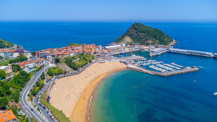 Getaria, basque country, spain, aerial view of the town, beach, and harbor on a sunny summer day