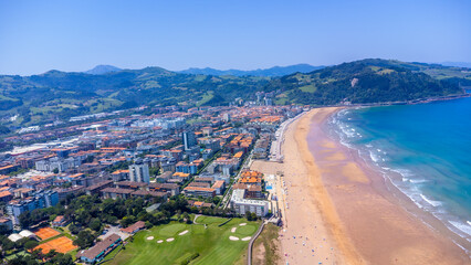 Zarautz cityscape embracing the basque coastline in summer sunlight