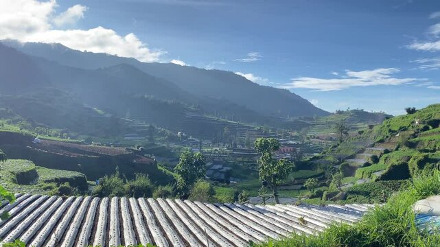 Terraced Farmland and Fast-Moving Clouds in the Dieng Highlands, Indonesia