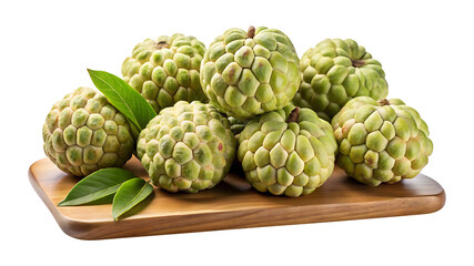 Fototapeta premium Arrangement of fresh custard apples with leaves displayed on wooden board