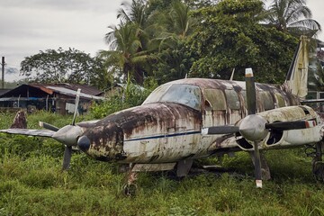 Small old plane abandoned in the jungle