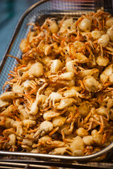 a large pile of deep-fried small crabs