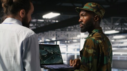 Soldier in server room uses geospatial data to support evacuation during emergency operations....