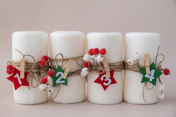 New year and Christmas preparation. Four-week advent candles on table. Handmade eco-friendly decor....