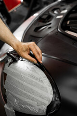 Wrapping vinyl requires perfect tension and accurate blade work for high-end detailing. Vinyl film...