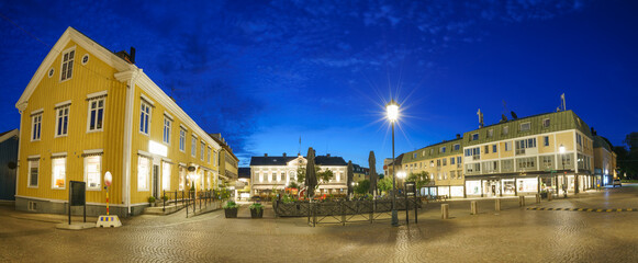 Narrow streets of St Albans with dining tables and chairs . England