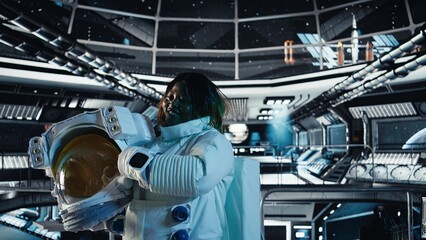 Portrait of happy astronaut holding helmet before stepping out for scheduled operations outside...