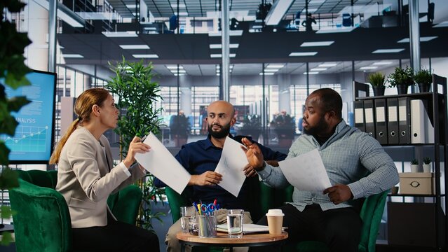 Corporate dispute involving powerful people during a briefing meeting, misunderstanding over strategic thinking. Disagreement due to frustration in a multicultural environment. Camera A.