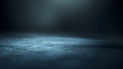 Obraz premium Moody Blue Gradient Surface – Dimly Lit Textured Background with Soft Overhead Light and Atmospheric Shadows in an empty space.