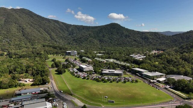 James Cook University Smithfield Campus, Cairns, Queensland, Australia: 4K Aerial Drone Footage of University Campus Surrounded by Tropical Rainforest, Green Hills, Urban Roads, and Natural Landscape