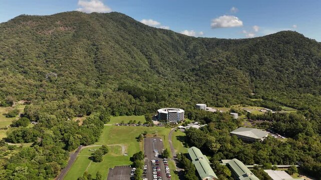 James Cook University Smithfield Campus, Cairns, Queensland, Australia: 4K Aerial Drone Footage of University Campus Surrounded by Tropical Rainforest, Green Hills, Urban Roads, and Natural Landscape