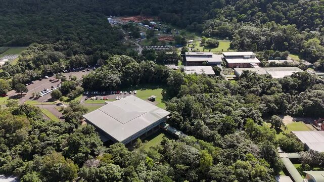 James Cook University Smithfield Campus, Cairns, Queensland, Australia: 4K Aerial Drone Footage of University Campus Surrounded by Tropical Rainforest, Green Hills, Urban Roads, and Natural Landscape