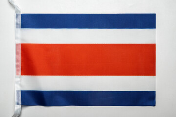 Closeup view of the Costa Rica national flag isolated over a white background. Concept of government and nationality