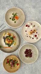 Marble tabletop with food plating plates placed on it