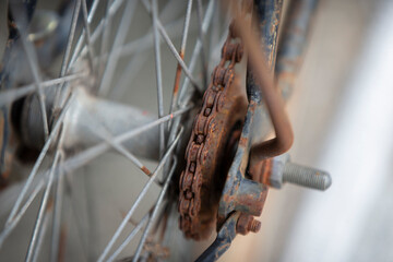 Close up of old bicycle wheel and chain. Selective focus.