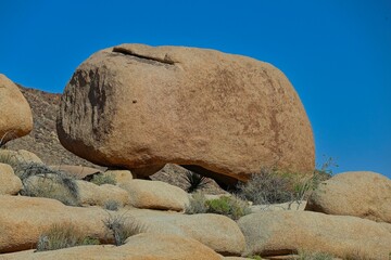Interesting rock formations and stacks of boulders bake in the desert sun in California's Joshua Tree National Park