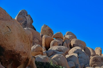 Interesting rock formations and stacks of boulders bake in the desert sun in California's Joshua Tree National Park