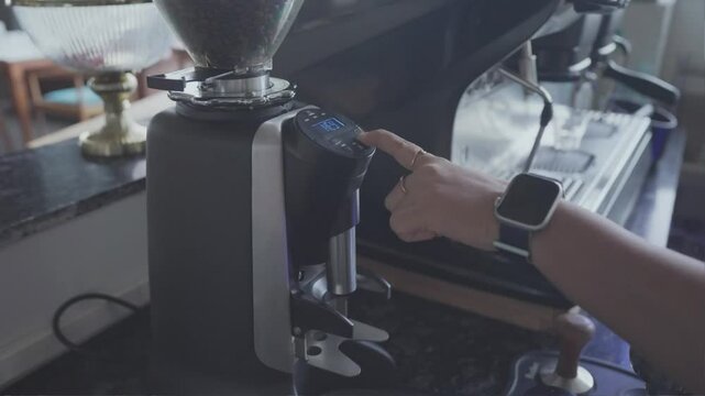 Barista prepares two cups of espresso. Medium shot