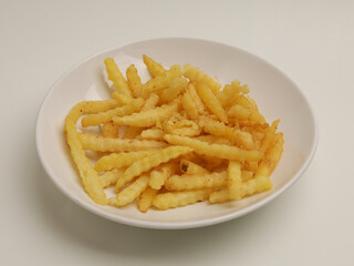 French fries on white plate, isolated 
