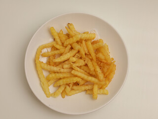 French fries on white plate, isolated 
