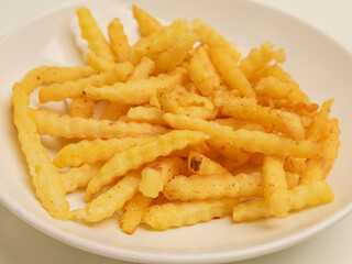French fries on white plate, isolated 