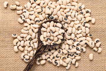 Black-eyed pea or cowpea in wooden spoon, Food ingredient, Top view