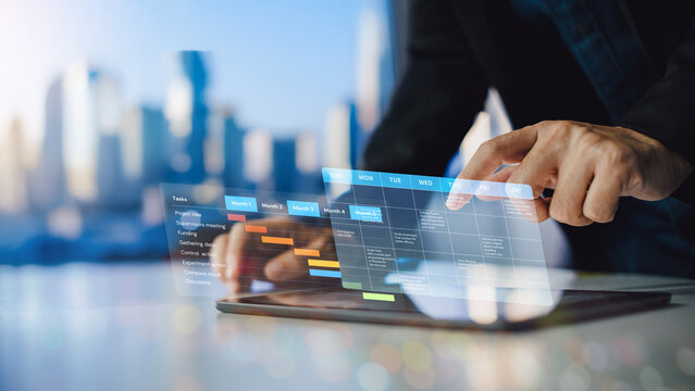 Business Monthly Planner Schedule on Digital Interface for Productivity and Workflow Management. Project manager working and update tasks with milestones progress planning.