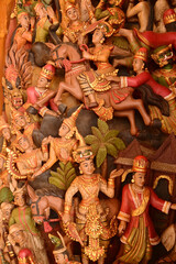 Wood carvings in Thai art on pillars in the temple church at Wat Den Sali Si Mueang Kaen temple or Wat Ban Den. Located at Chiang Mai Province in Thailand.