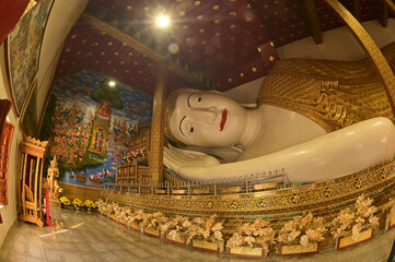 The Reclining white statue Phra Chaeo Nip Phran Buddha is enshrined in a teakwood chapel at Wat Den Sali Si Mueang Kaen temple or Wat Ban Den. Located at Cheng Mai Province in Thailand.