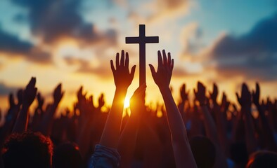 Uplifted hands in worship with cross silhouette at sunset for spiritual reflection