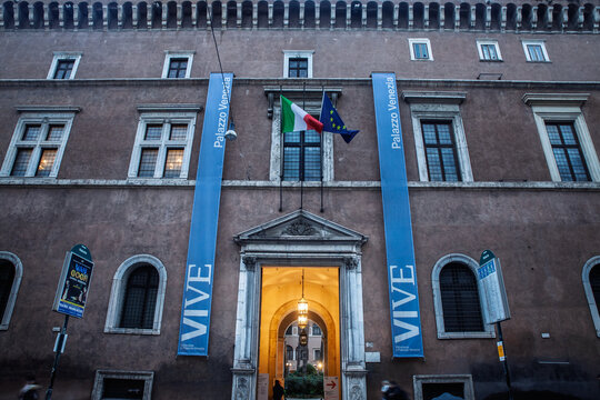 ROME, ITALY - JANUARY 15, 2025: Evening fa&ccedil;ade of Palazzo Venezia in central Rome with blue VIVE banners. palazzo venezia is a art museum, also called palazzo barbo.