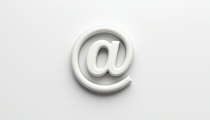 Wired computer mouse cord shaped like @ symbol on white background  