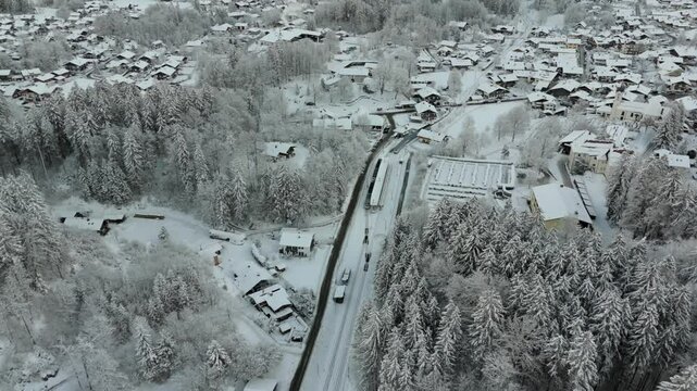 Snowy aerial panorama of Zugspitze Railway, Grainau station and Bavarian Alps. Perfect mix of nature, engineering and adventure in Germany winter landscape. Bayerische Zugspitzbahn Luftaufnahme winter