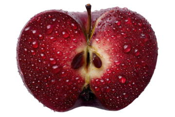 A close-up shot of a halved, red apple, glistening with water droplets, reveals its core and seeds against a black background
