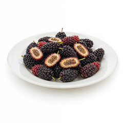 Fresh mulberries are displayed many on a white plate whole and halved delicious