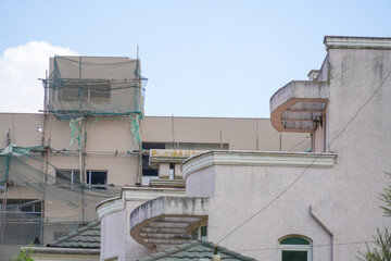 Construction site with cranes on sky background. Inside place for many tall buildings under construction and cranes under a sky.