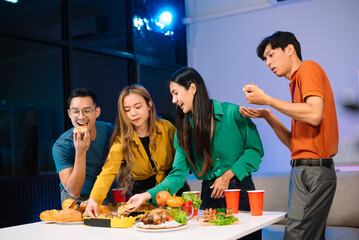 Young Asian Friends Celebrating with Laughter and Food at a Modern Evening Party