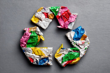 Recycling materials in shape of recycling symbol